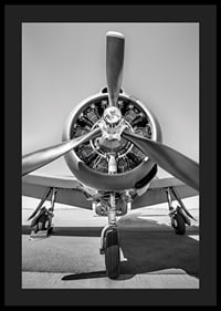 Black and white photograph of old propeller plane from the front-4