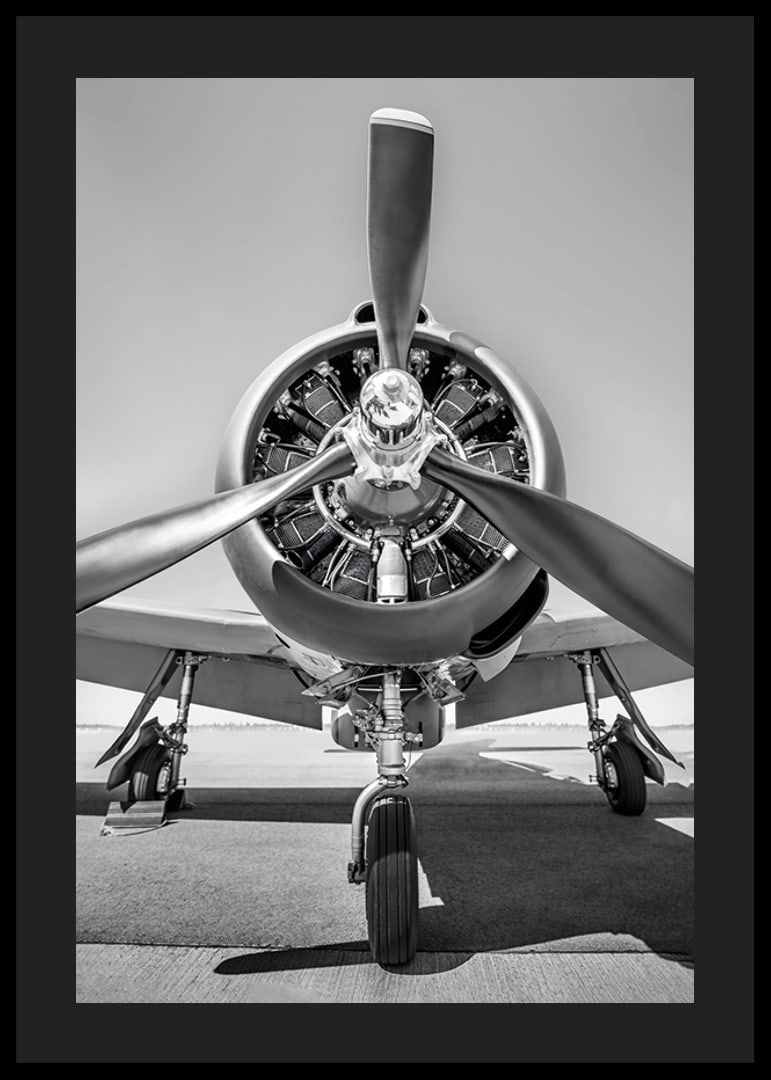 Black and white photograph of old propeller plane from the front-12