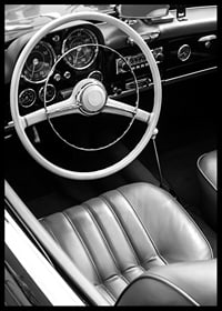 Black and white close-up of classic car interior with steering wheel-6