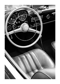 Black and white close-up of classic car interior with steering wheel-1