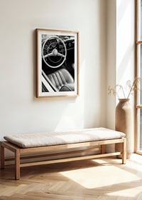 Black and white close-up of classic car interior with steering wheel-8