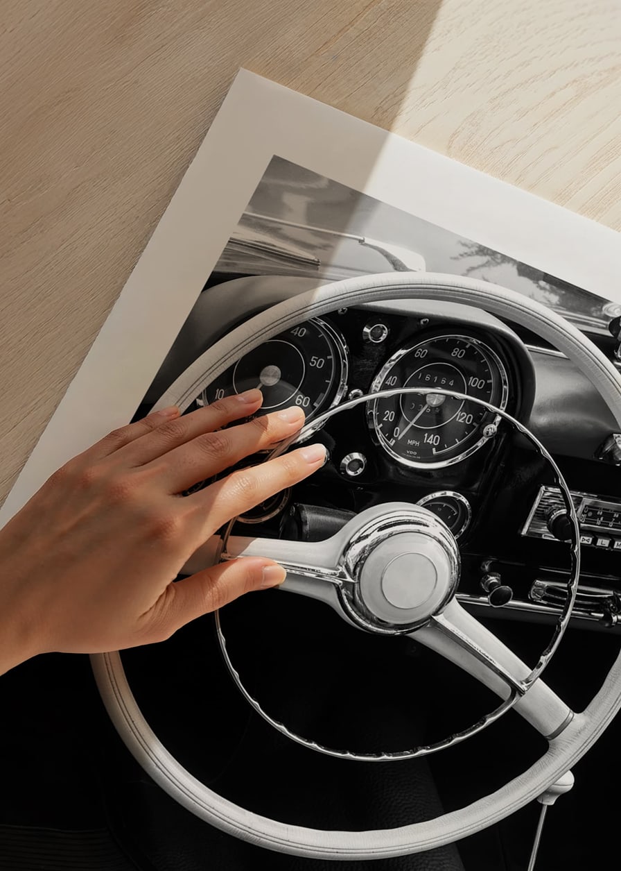 Black and white close-up of classic car interior with steering wheel-12