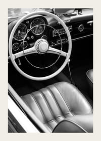 Black and white close-up of classic car interior with steering wheel-3