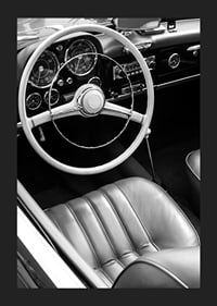 Black and white close-up of classic car interior with steering wheel-5