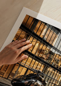 Black helicopter on city street in front of glass facade in evening light-9