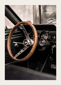 Photograph of classic car interior with wooden steering wheel in focus-3