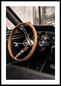 Photograph of classic car interior with wooden steering wheel in focus-0