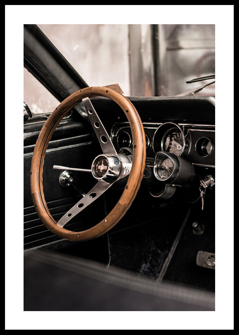 Photograph of classic car interior with wooden steering wheel in focus-12