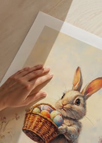 Illustrated rabbit with basket of Easter eggs in blooming spring meadow-9