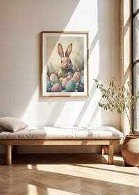 Illustrated rabbit among pastel colored Easter eggs and grass-8