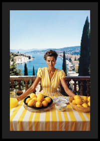 Woman in yellow striped dress with lemons on Mediterranean coast-4