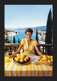 Woman in yellow striped dress with lemons on Mediterranean coast-5