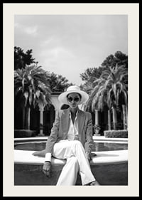 Black and white photo of woman in suit and sun hat by pool-2