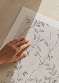 Abstract thin branches with small leaves in gray tones against light background-9