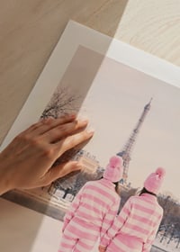 Two people in pink striped pajamas, winter at the Eiffel Tower-9