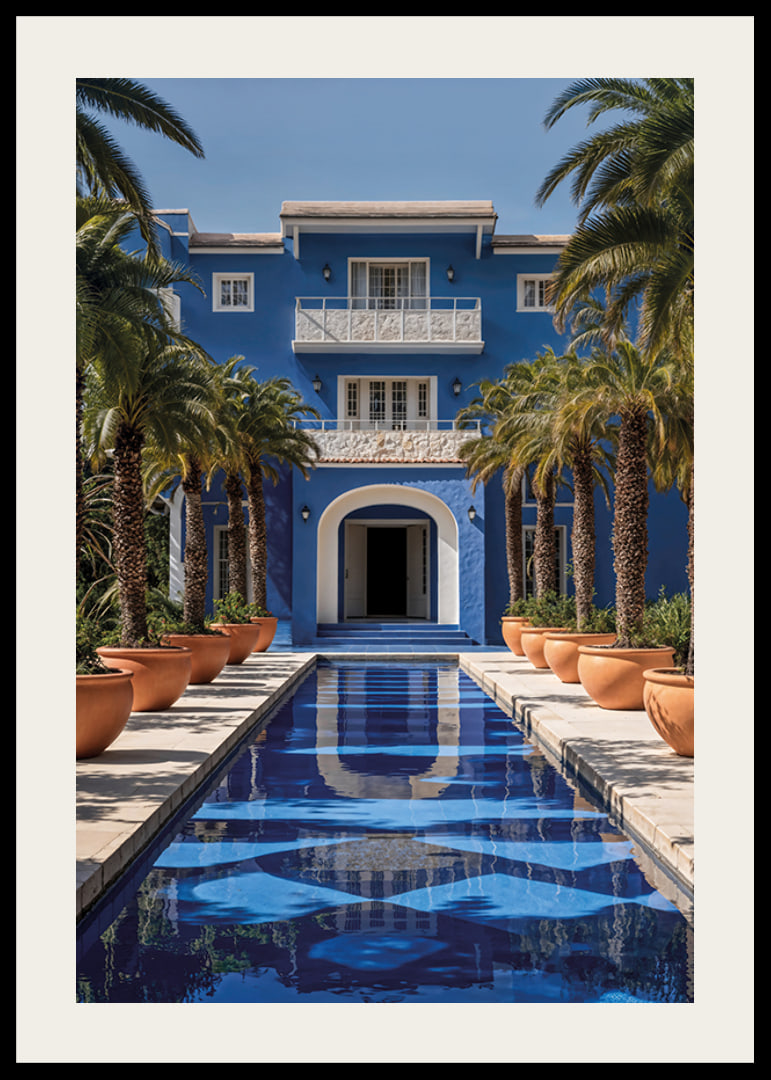 Photograph of blue villa with palm trees and long swimming pool in the foreground-12