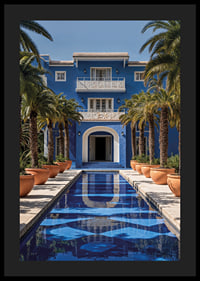 Photograph of blue villa with palm trees and long swimming pool in the foreground-4