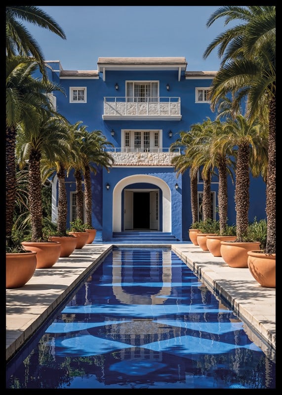 Photograph of blue villa with palm trees and long swimming pool in the foreground-12