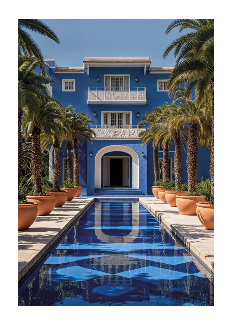 Photograph of blue villa with palm trees and long swimming pool in the foreground-12