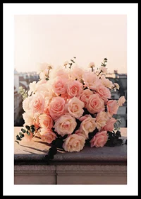 Close-up of bouquet of light pink roses against city skyline-0
