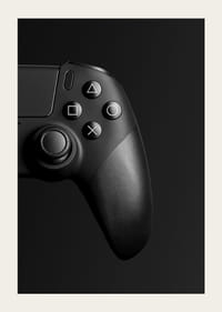 Close-up of black game controller with matte black background-5