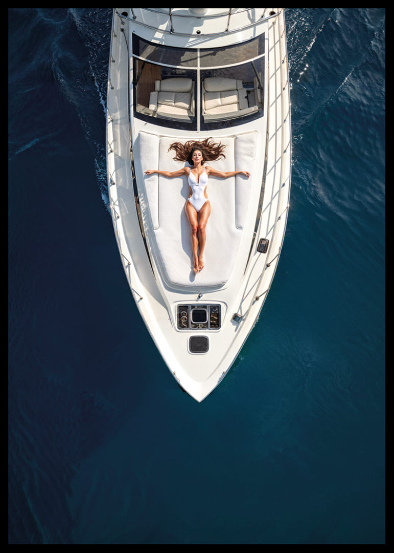 Aerial view of woman in white swimsuit on luxury yacht over turquoise sea-12