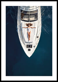 Aerial view of woman in white swimsuit on luxury yacht over turquoise sea-0