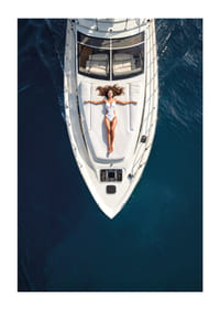 Aerial view of woman in white swimsuit on luxury yacht over turquoise sea-1