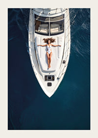 Aerial view of woman in white swimsuit on luxury yacht over turquoise sea-3
