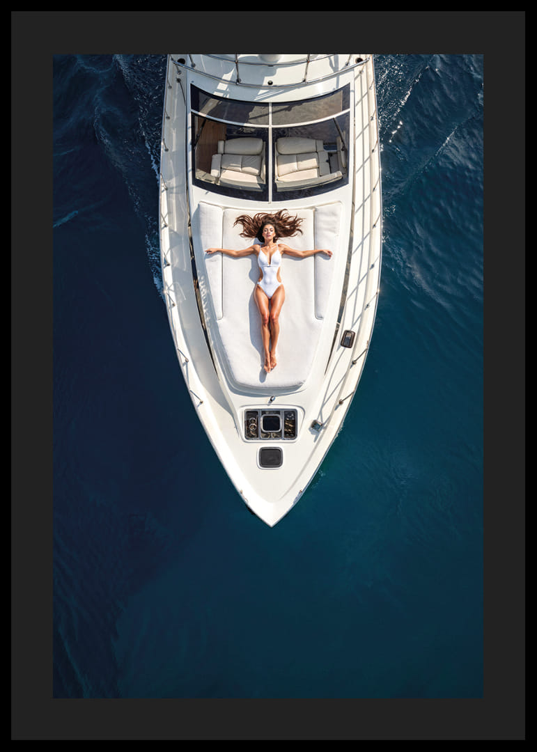 Aerial view of woman in white swimsuit on luxury yacht over turquoise sea-12