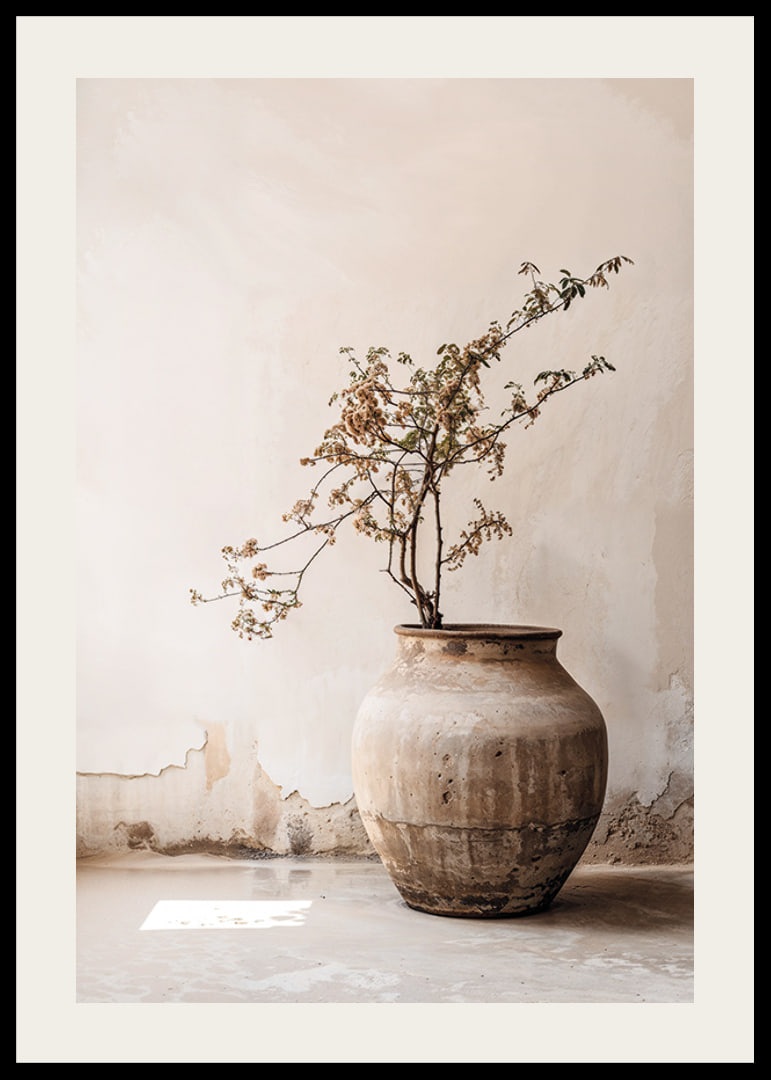 Photograph of rustic clay pot with flowering twig in soft beige tones-12