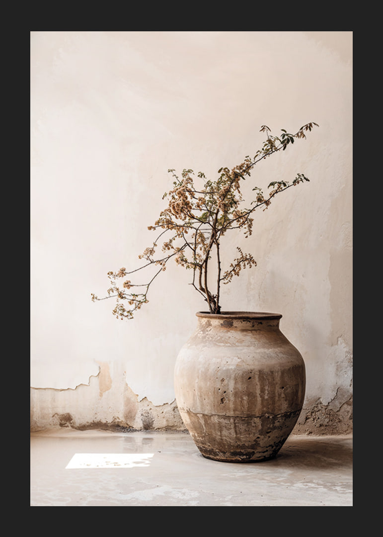 Photograph of rustic clay pot with flowering twig in soft beige tones-12