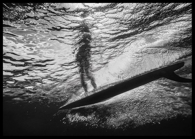 Black and white poster with a photograph of an underwater view with a silhouette of a surfer-12