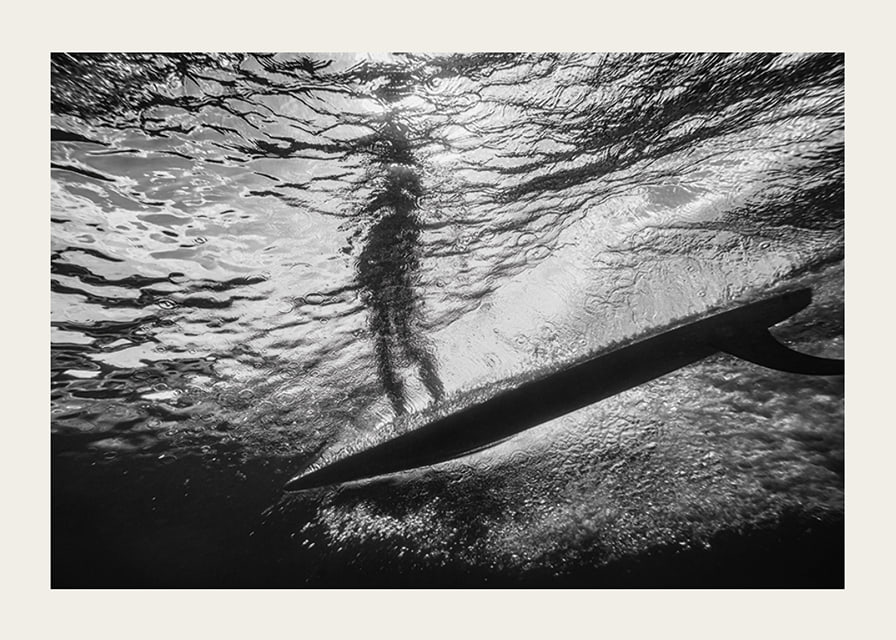 Black and white poster with a photograph of an underwater view with a silhouette of a surfer-12