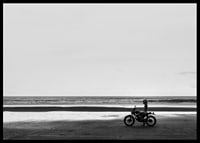 Black and white poster with a photograph of a lone motorcycle on a deserted beach-6