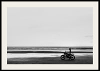 Black and white poster with a photograph of a lone motorcycle on a deserted beach-2