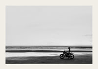 Black and white poster with a photograph of a lone motorcycle on a deserted beach-3