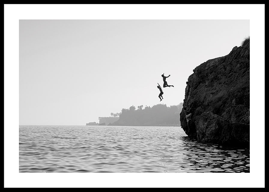 Black and white poster with a photograph of two people jumping from a cliff into the sea-12