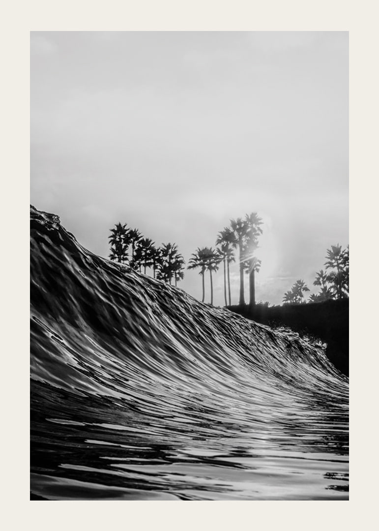 Black and white poster with a photograph that captures a dramatic view of a crashing wave-12