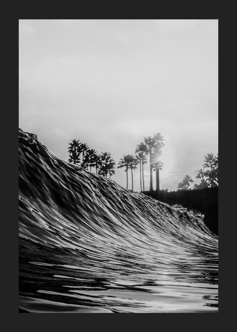 Black and white poster with a photograph that captures a dramatic view of a crashing wave-12