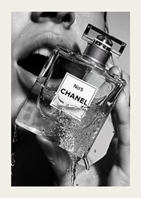 Black and white poster with a sensual photograph of a woman holding a Chanel No5 perfume bottle-3