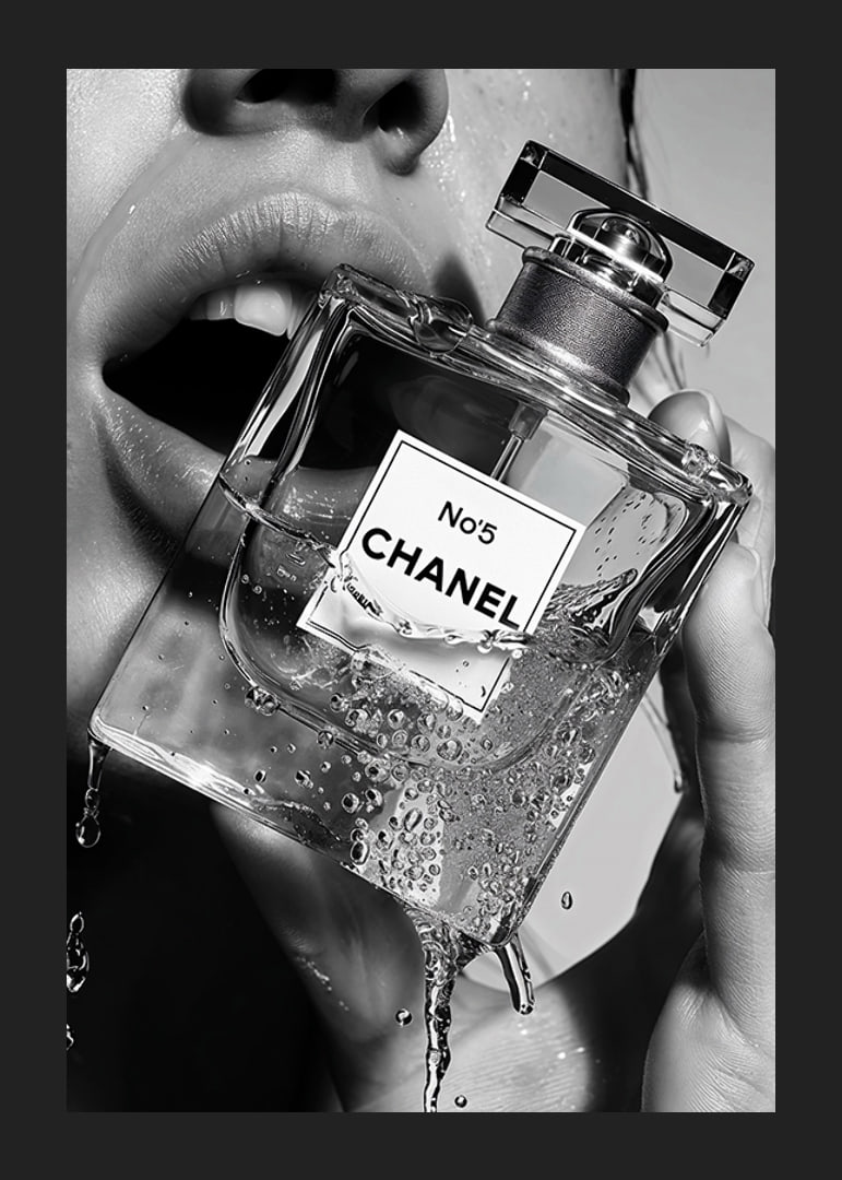 Black and white poster with a sensual photograph of a woman holding a Chanel No5 perfume bottle-12