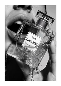 Black and white poster with a sensual photograph of a woman holding a Chanel No5 perfume bottle-1