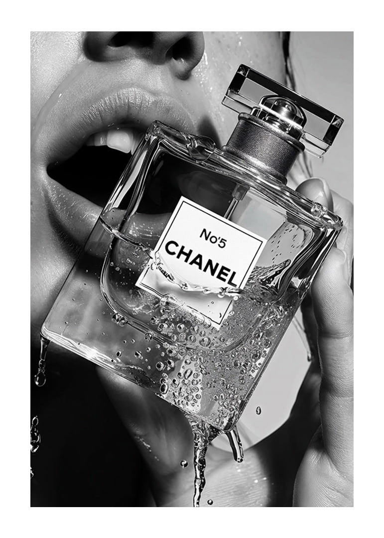 Black and white poster with a sensual photograph of a woman holding a Chanel No5 perfume bottle-12