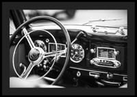 Black and white poster with a photograph on the dashboard of a classic car-4