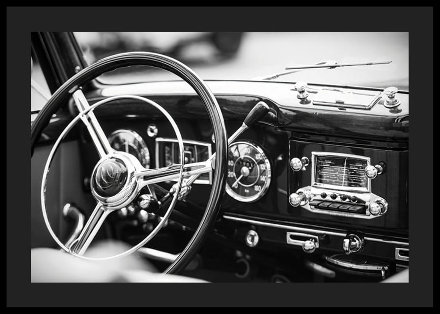Black and white poster with a photograph on the dashboard of a classic car-12