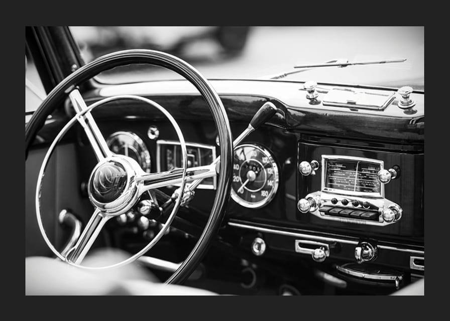Black and white poster with a photograph on the dashboard of a classic car-12