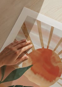 Poster with a watercolor painting of a sun over a mountainous landscape-9