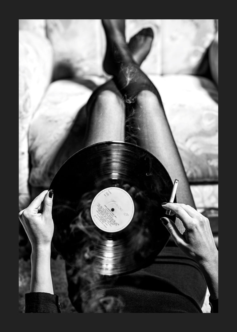 Poster with a vintage black and white photograph of a woman holding a vinyl record-12