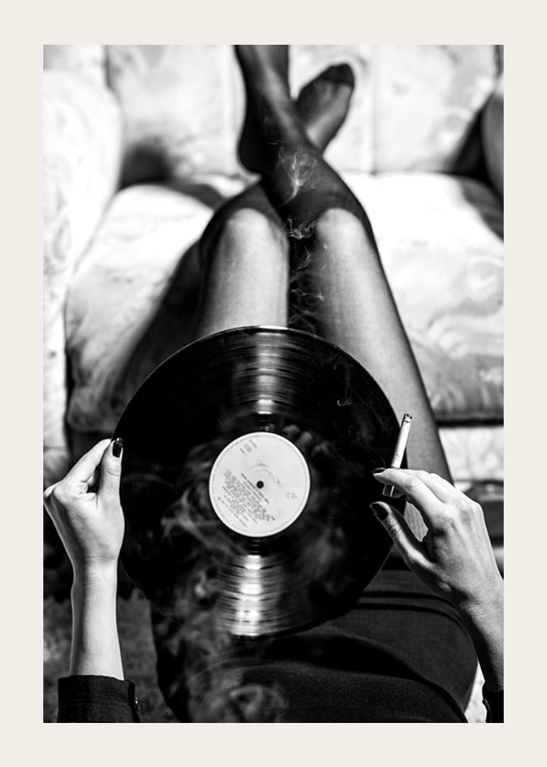 Poster with a vintage black and white photograph of a woman holding a vinyl record-12